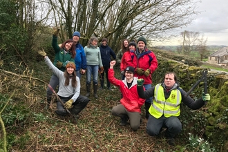 The Bay and Myplace teams working together to tidy up some land