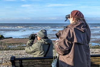 a person looking out over morecambe bay 