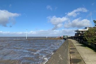 Knott End Prom looking across a high tide towards the slipway