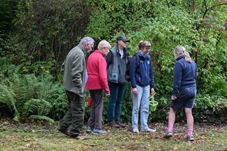 A group of people in the garden.
