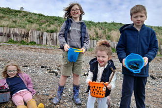 Children exploring the shore line