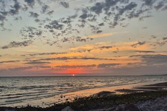 A beach at sunset.