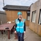 Jane from the Bay wearing blue Bay hat and hi vis