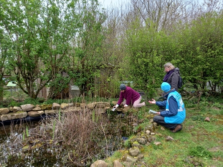 Alex and Nature and Wellbeing Participants identifying bees in Happy Mount Park