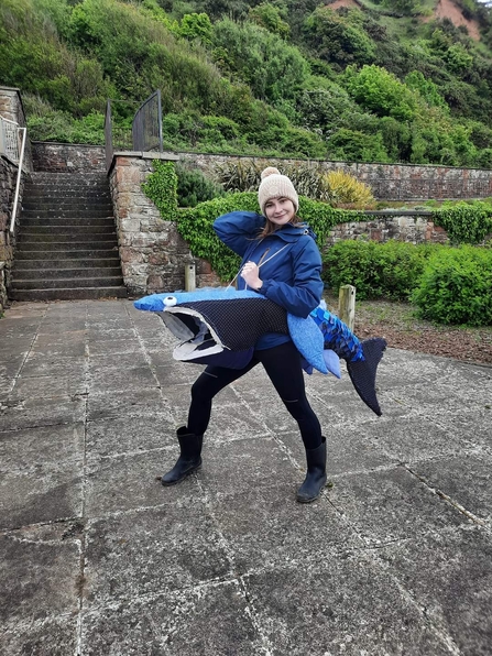 A woman wearing a fish costume