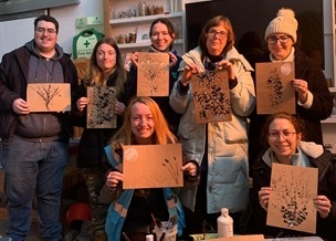 A group of people with artwork